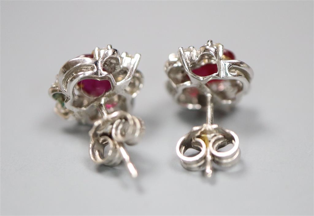 A modern pair of white metal (stamped 750), ruby and diamond cluster ear studs, 10mm, gross 2.3 grams.